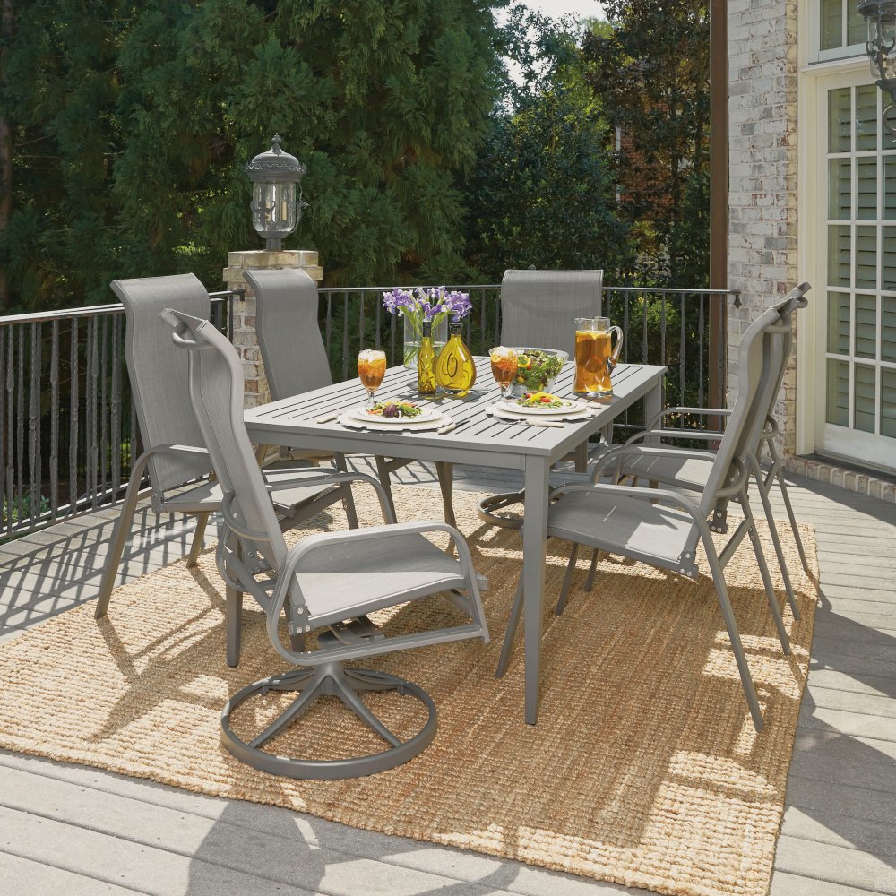 Daytona 7 Pc Rectangular Outdoor Dining Table With 4 Sling Arm 5702 55 Daytona Swivel Rocking Arm Chair 3115 Seven Piece Rectangular Outdoor Dining Table With Four Sling Chairs And